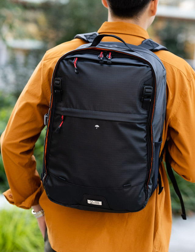 Man wearing Two Wheel Gear pannier backpack on back
